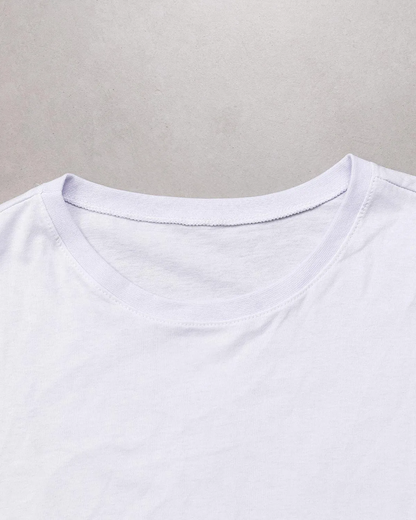 “Fabric texture detail of women’s white 100% cotton relaxed fit T-shirt.”